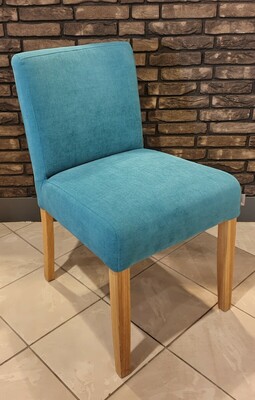 Eleganckie, miękki i wygodne krzesło Woof, w pięknym turkusowym kolorze.